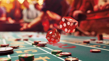Rolling dice on a craps table
