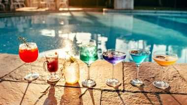 Cocktails in front of a pool