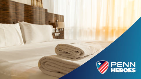 hotel room with PENN Heroes shield