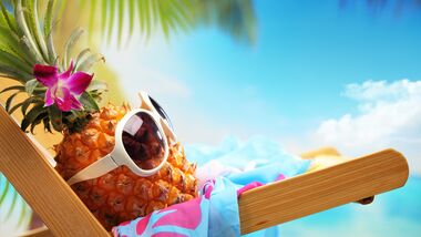 pineapple wearing sunglasses on vacation